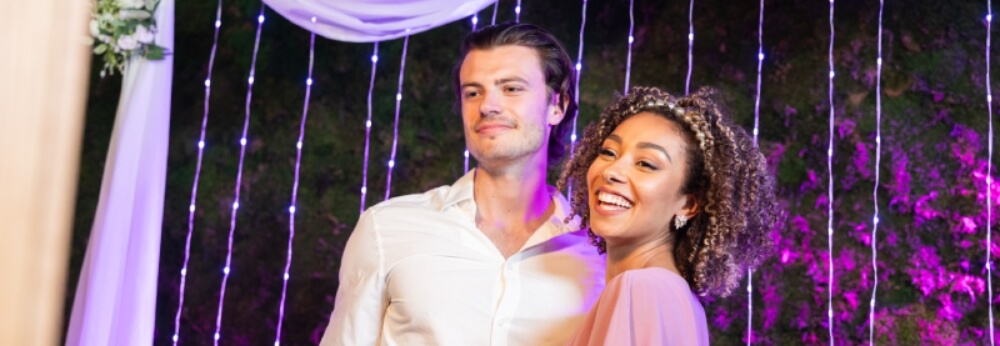 Two people in front of a photo booth